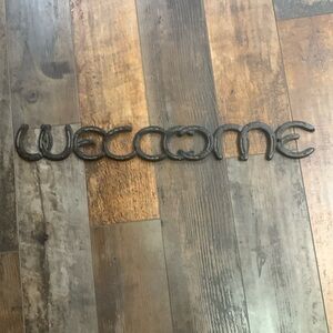 Metal horseshoe welcome
